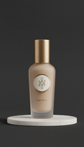 Luxe ritual hair oil with subtle metallic accents
